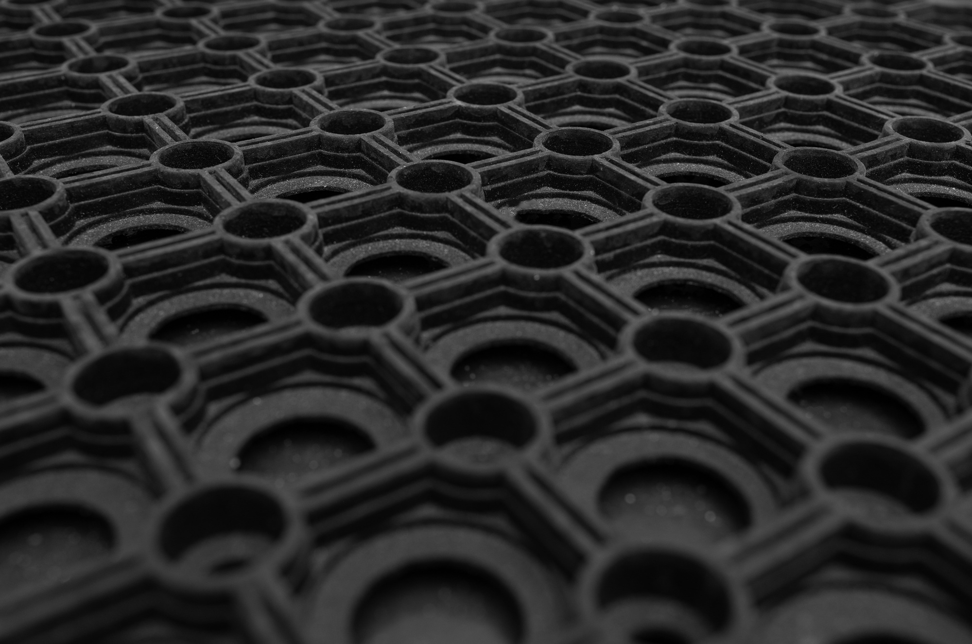 A close-up of a black rubber carpet