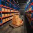 Interior warehouse storage and cardboard boxes against boxes on pallet.